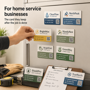 Hand placing a business card on a refrigerator with various service business cards displayed.