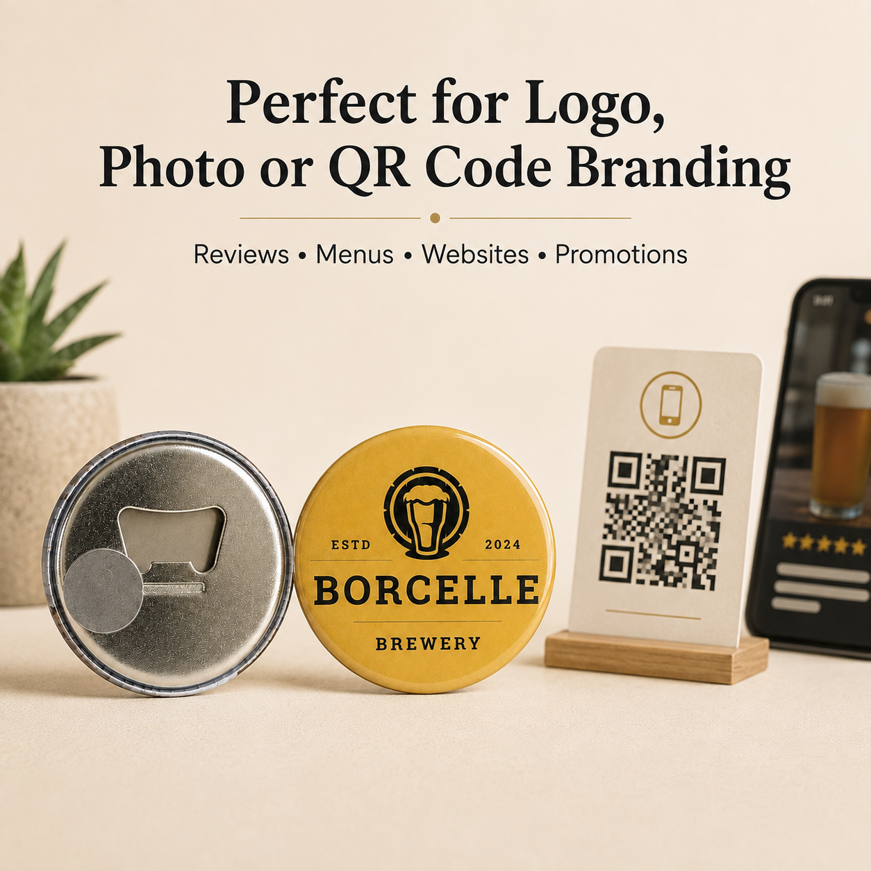 Three branded custom branding items on a beige tabletop: a silver metal pinback button with a bottle opener cutout, a round yellow button reading BORCELLE BREWERY, and a small wooden stand holding a white card with a QR code and beer photo. Large text above says it is perfect for logo, photo or QR code branding.