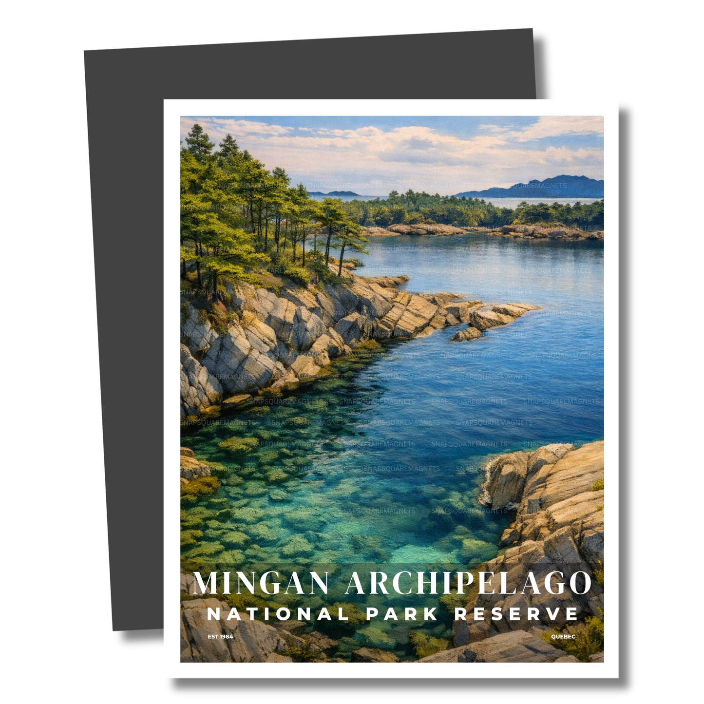 Magnet of a scenic view of a lake with rocks and trees, featuring 'Mingan Archipelago National Park Reserve'.