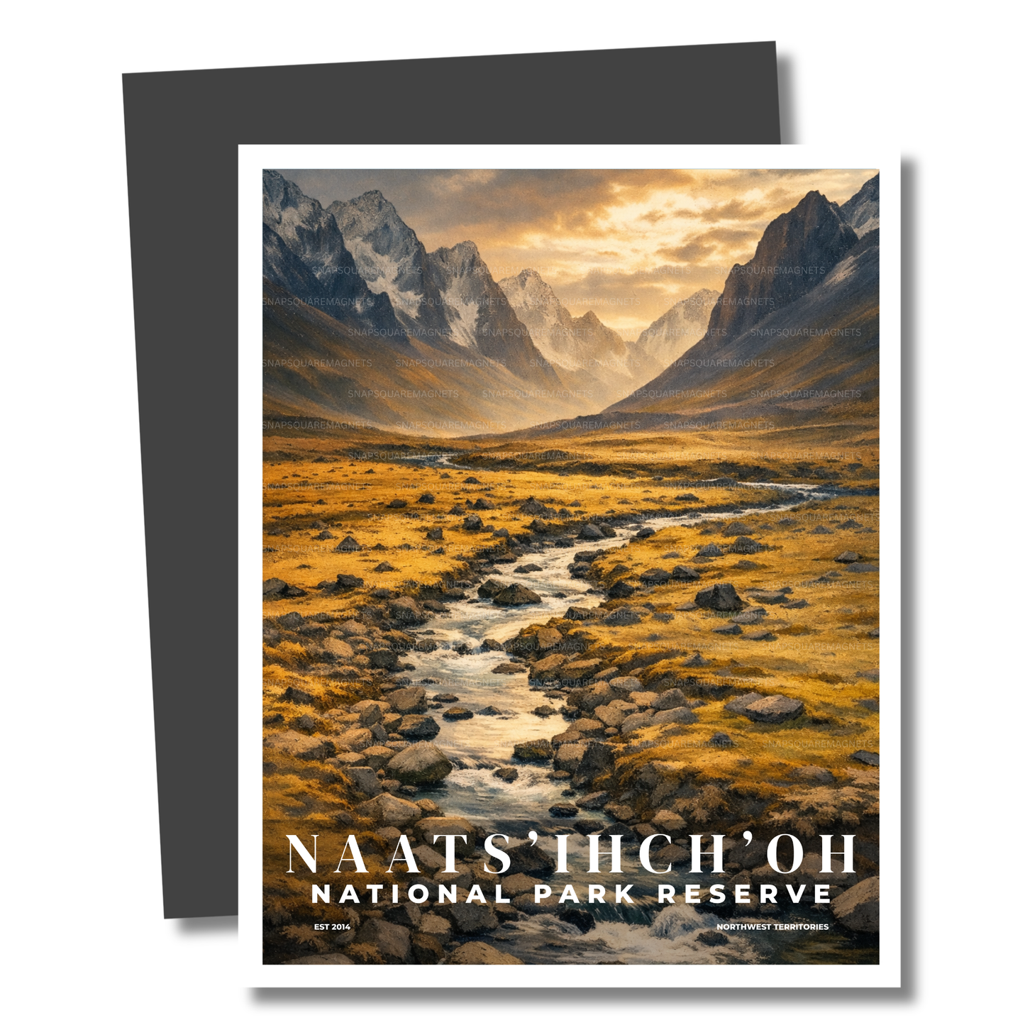 Magnet of a mountain landscape with a stream and 'Naats'ihch'oh National Park Reserve' text.