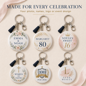 Six personalized round keychains with black tassels and silver keyrings, arranged in a 2x3 grid on a light blush background. The keychains feature floral and celebratory designs including names, numbers, and milestone text such as 'EMMA & NOAH', 'MARGARET 80', 'SOFIA'S SWEET 16', 'WOMEN OF FAITH', '100 YEARS 1926–2026', and 'LUXE BEAUTY'.