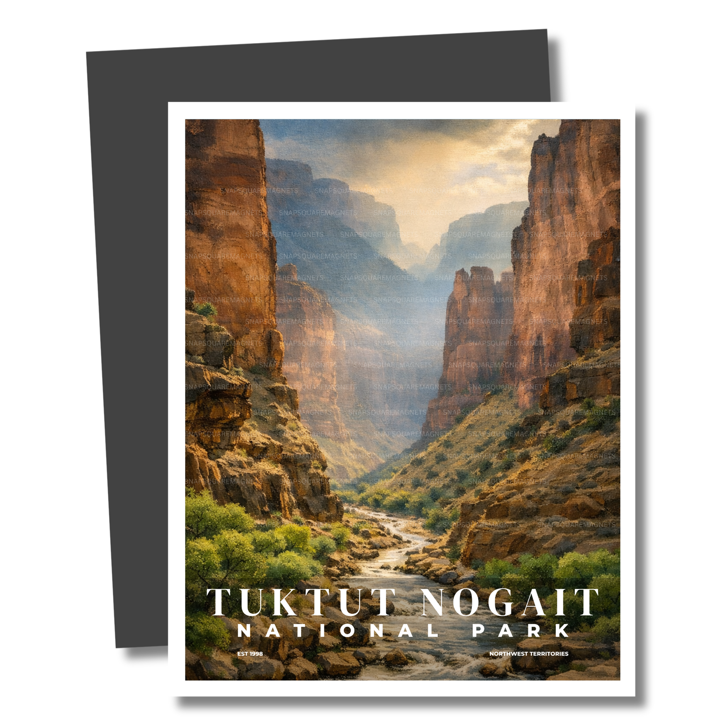 Magnet of Tuktut Nogait National Park with a scenic view of cliffs and a river.