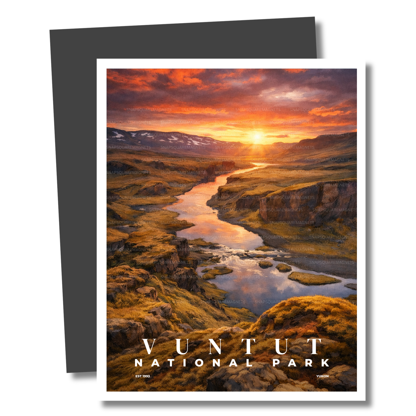 Magnet of Vuntut National Park with a sunset over a river and mountains.